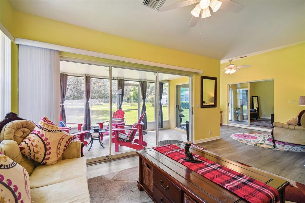 12728 Flamingo Parkway Spring Hill, FL 34610 - Photo 40 of 54 a living room with furniture and large windows