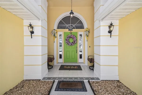 a view of a entryway door with wooden floor