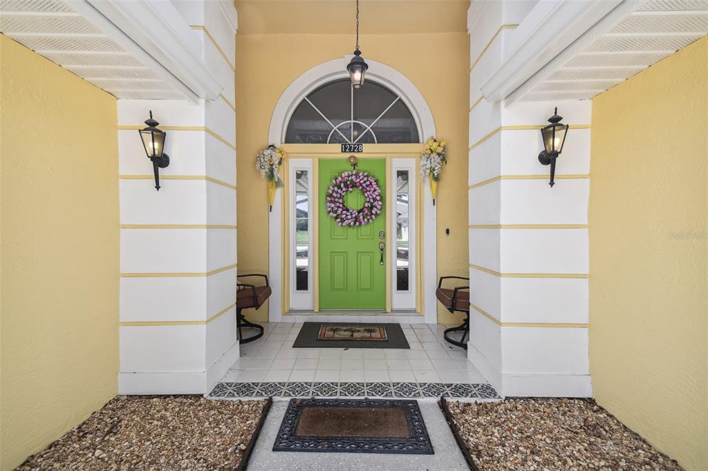 12728 Flamingo Parkway Spring Hill, FL 34610 - Photo 4 of 54 a view of a entryway door with wooden floor