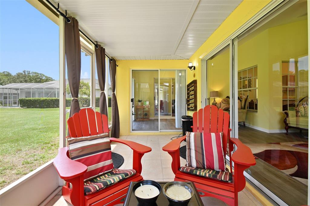 12728 Flamingo Parkway Spring Hill, FL 34610 - Photo 46 of 54 a view of balcony with two chairs and a table