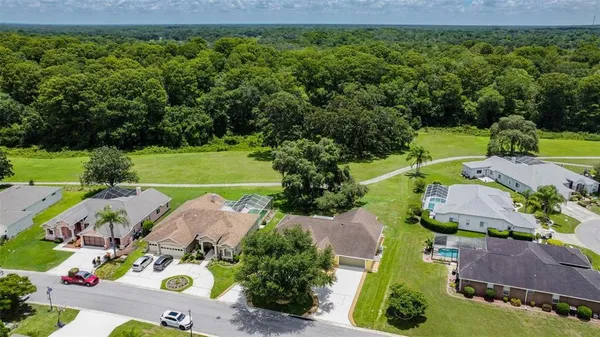 an aerial view of a house with a garden