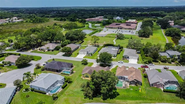 an aerial view of house with a yard