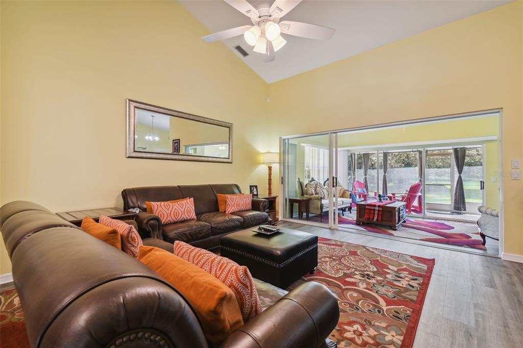 12728 Flamingo Parkway Spring Hill, FL 34610 - Photo 8 of 54 a living room with furniture and a large window