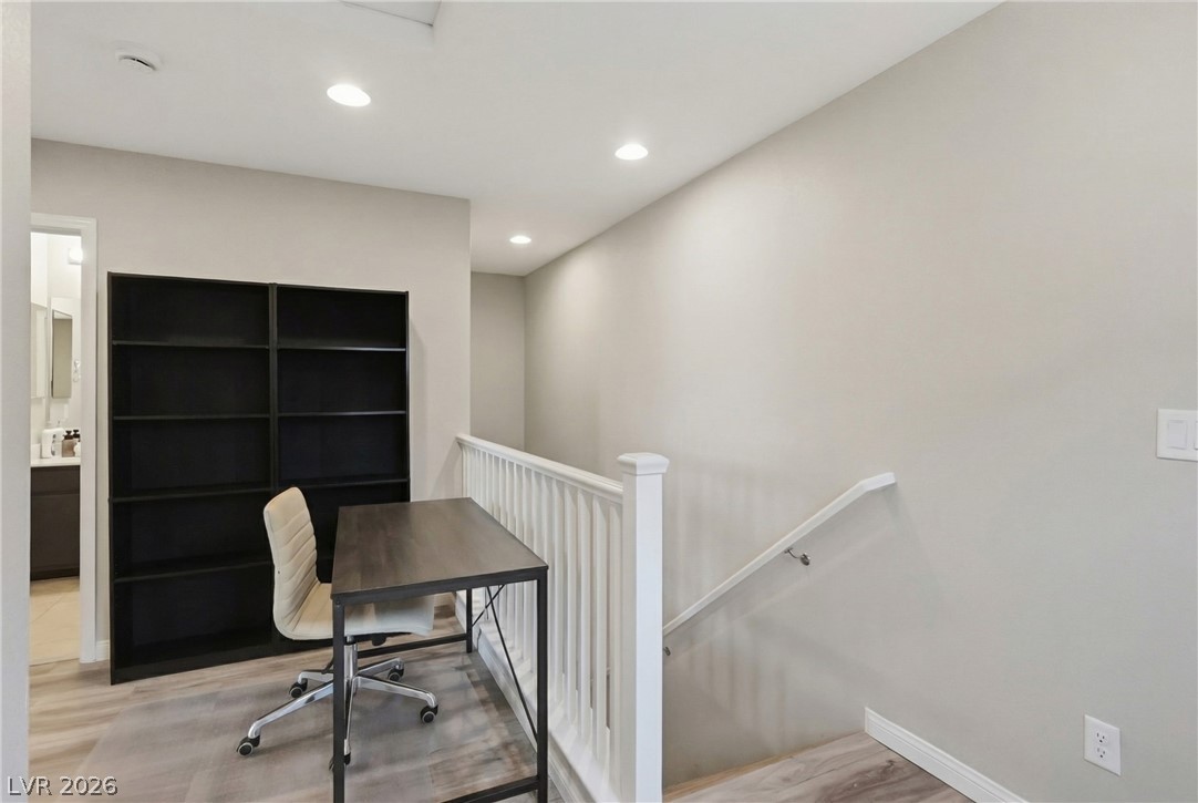 1921 Miller Ridge Avenue North Las Vegas, NV 89031 - Photo 12 of 26 Bright and inviting flex area features recessed lighting and durable wood flooring.