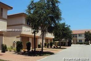 1925 Gardenia Court, Unit 1925 Riviera Beach, FL 33404 - Photo 2 of 10 a view of a building with a street