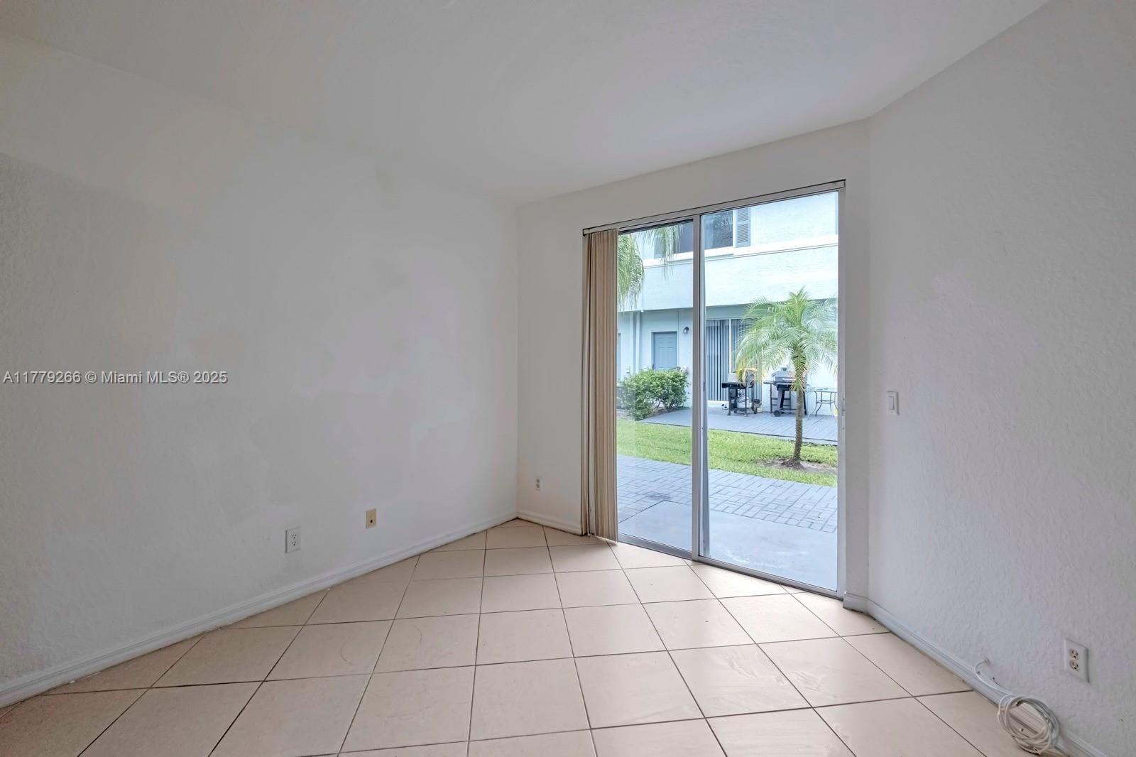 1925 Gardenia Court, Unit 1925 Riviera Beach, FL 33404 - Photo 7 of 10 a view of an empty room and bathroom