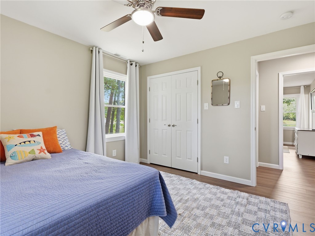 597 Harbor Drive Reedville, VA 22539 - Photo 23 of 34 Bright room featuring a window with wooded scenery