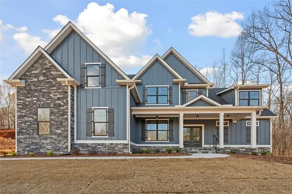 a front view of a house with yard