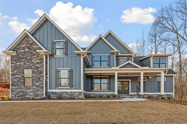 a front view of a house with yard