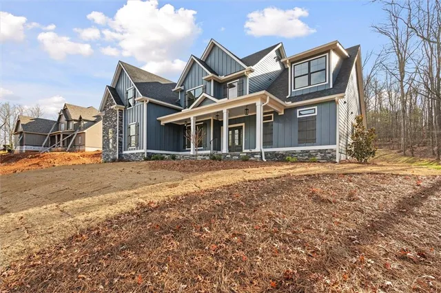 a front view of a house wth yard