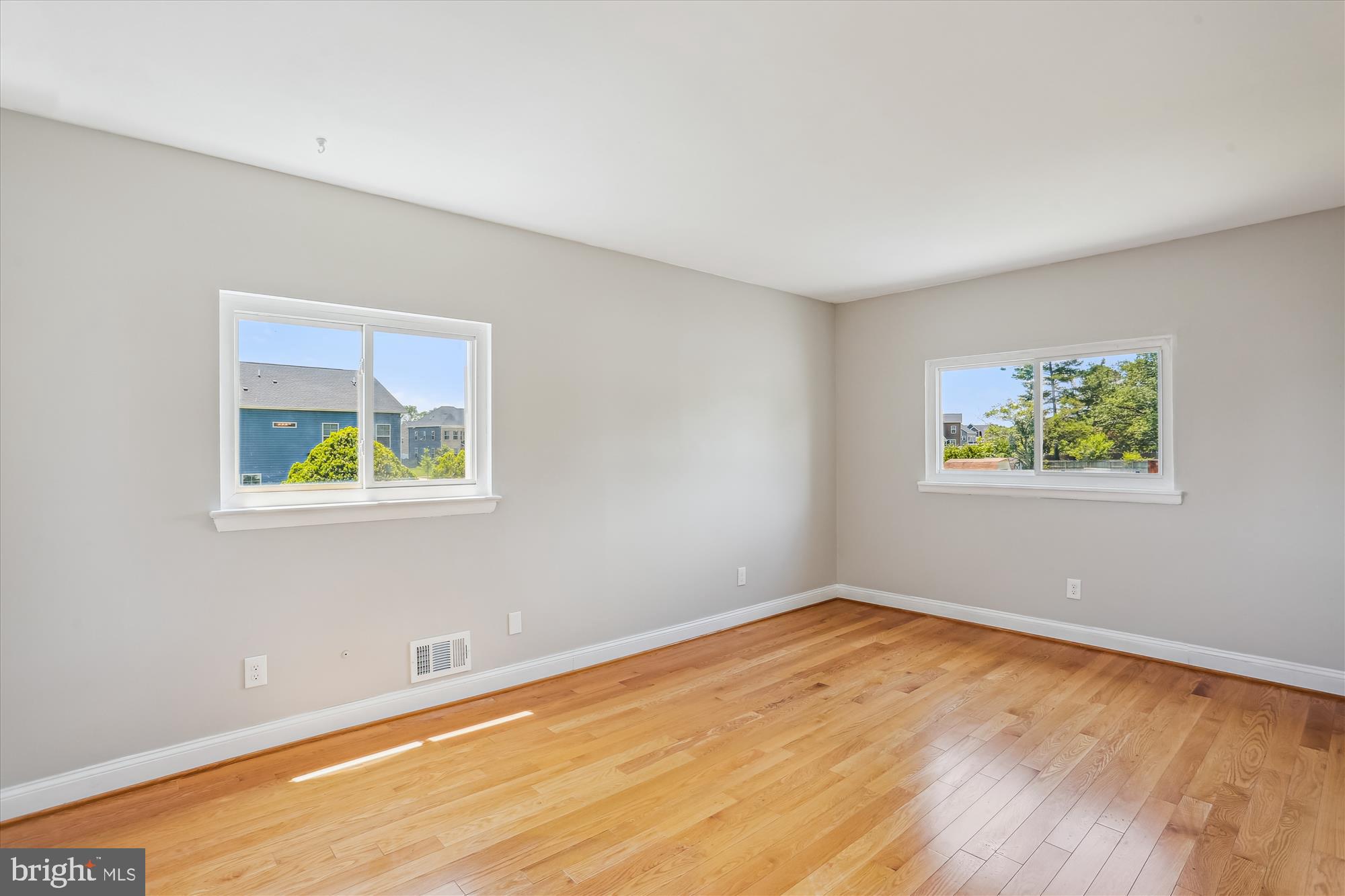 19916 Westerly Avenue Poolesville, MD 20837 - Photo 15 of 34 a view of an empty room with window and wooden floor