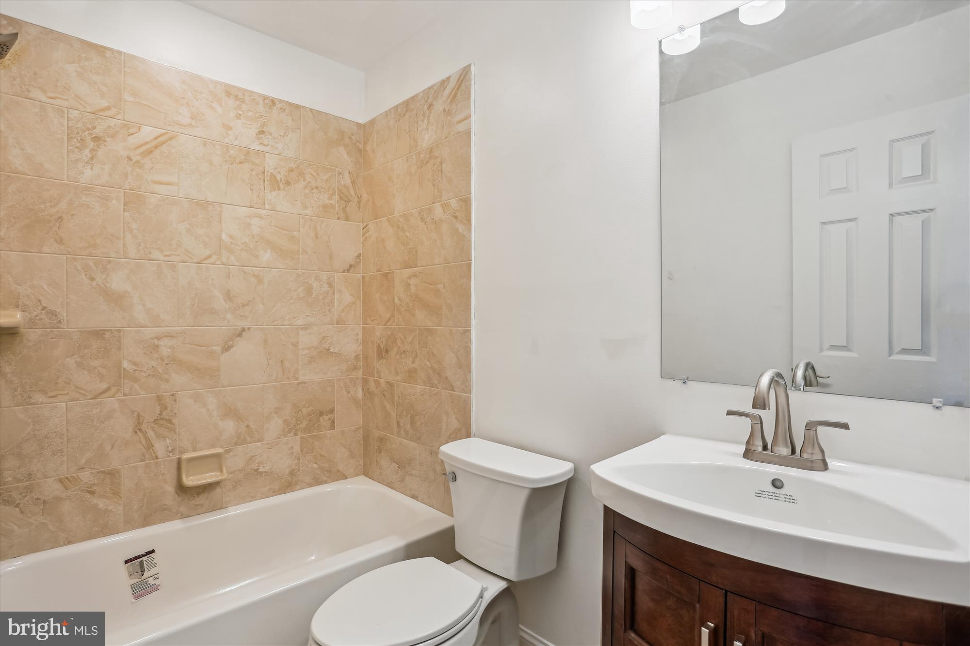 19916 Westerly Avenue Poolesville, MD 20837 - Photo 16 of 34 a bathroom with a sink toilet and shower