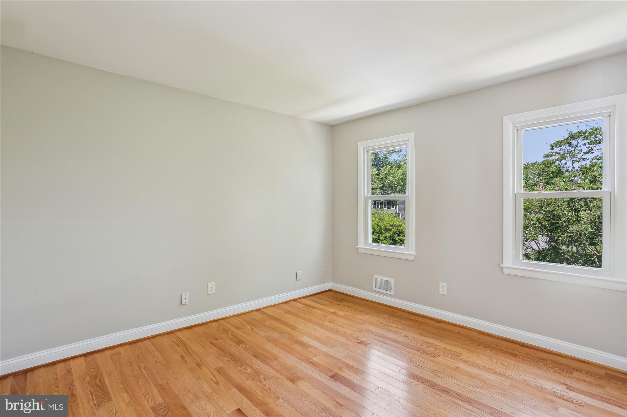 19916 Westerly Avenue Poolesville, MD 20837 - Photo 18 of 34 an empty room with wooden floor and windows