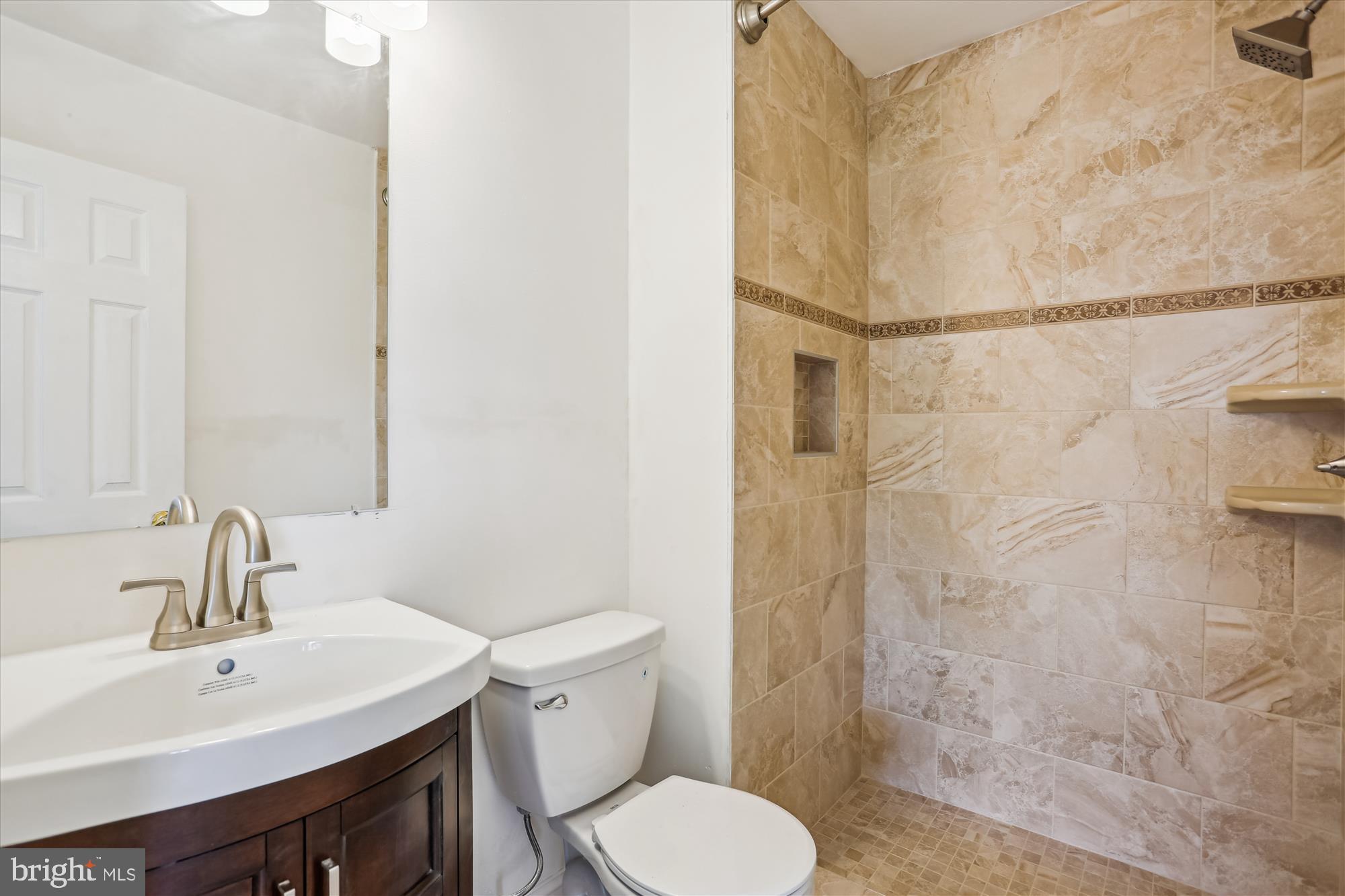 19916 Westerly Avenue Poolesville, MD 20837 - Photo 21 of 34 a bathroom with a sink toilet and shower