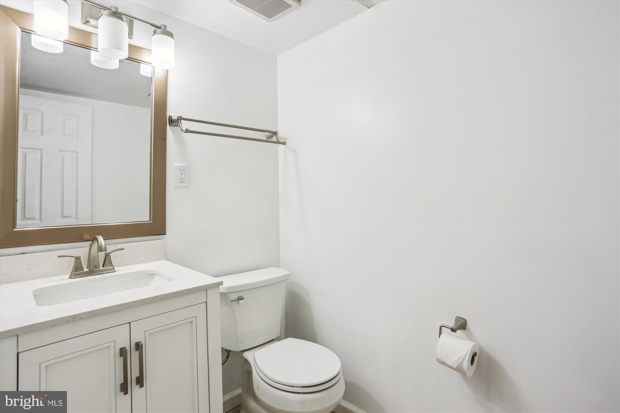 19916 Westerly Avenue Poolesville, MD 20837 - Photo 24 of 34 a bathroom with a sink a toilet and shower