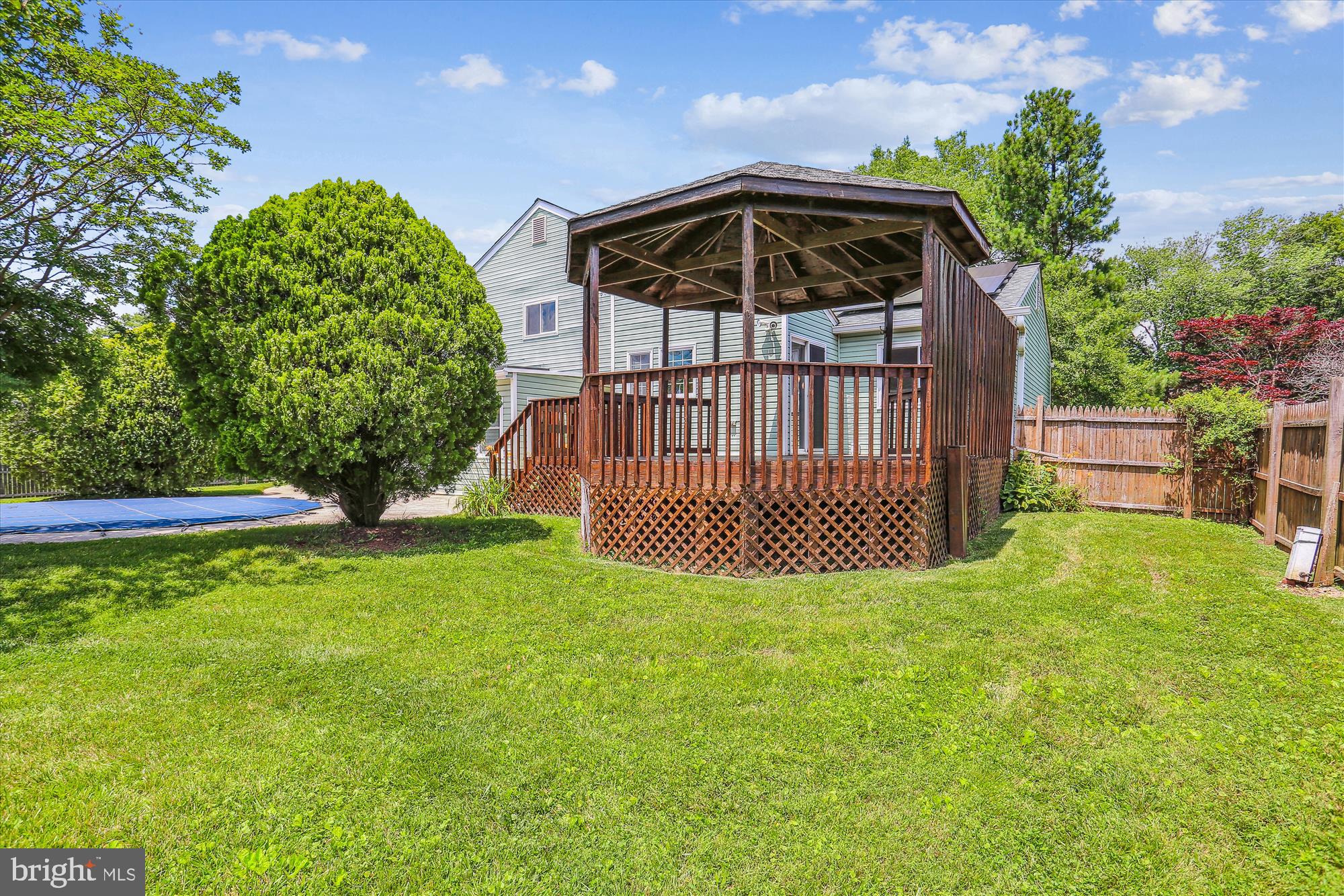 19916 Westerly Avenue Poolesville, MD 20837 - Photo 30 of 34 a view of a deck with a yard