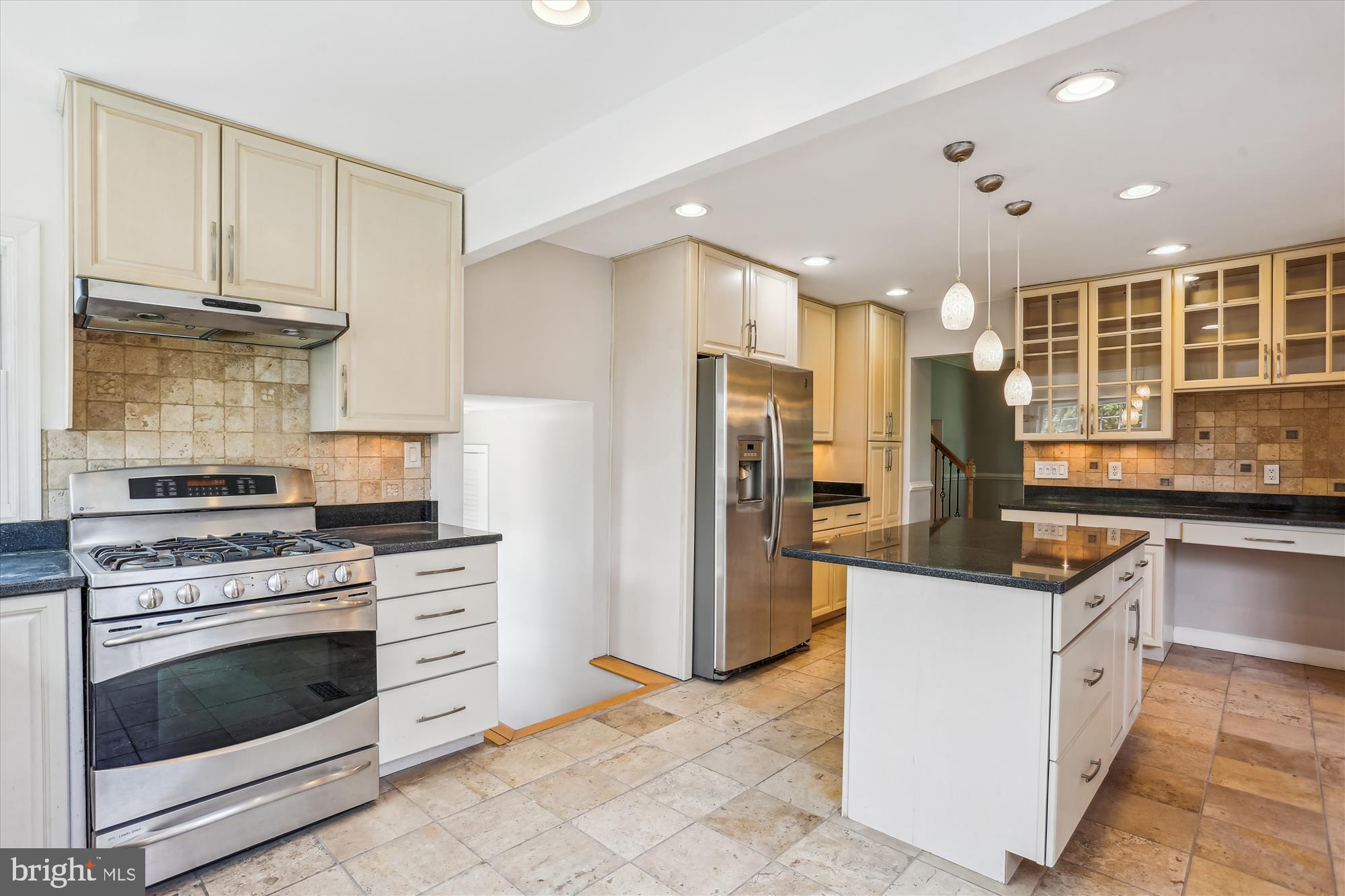 19916 Westerly Avenue Poolesville, MD 20837 - Photo 5 of 34 a kitchen with stainless steel appliances granite countertop a stove and a refrigerator