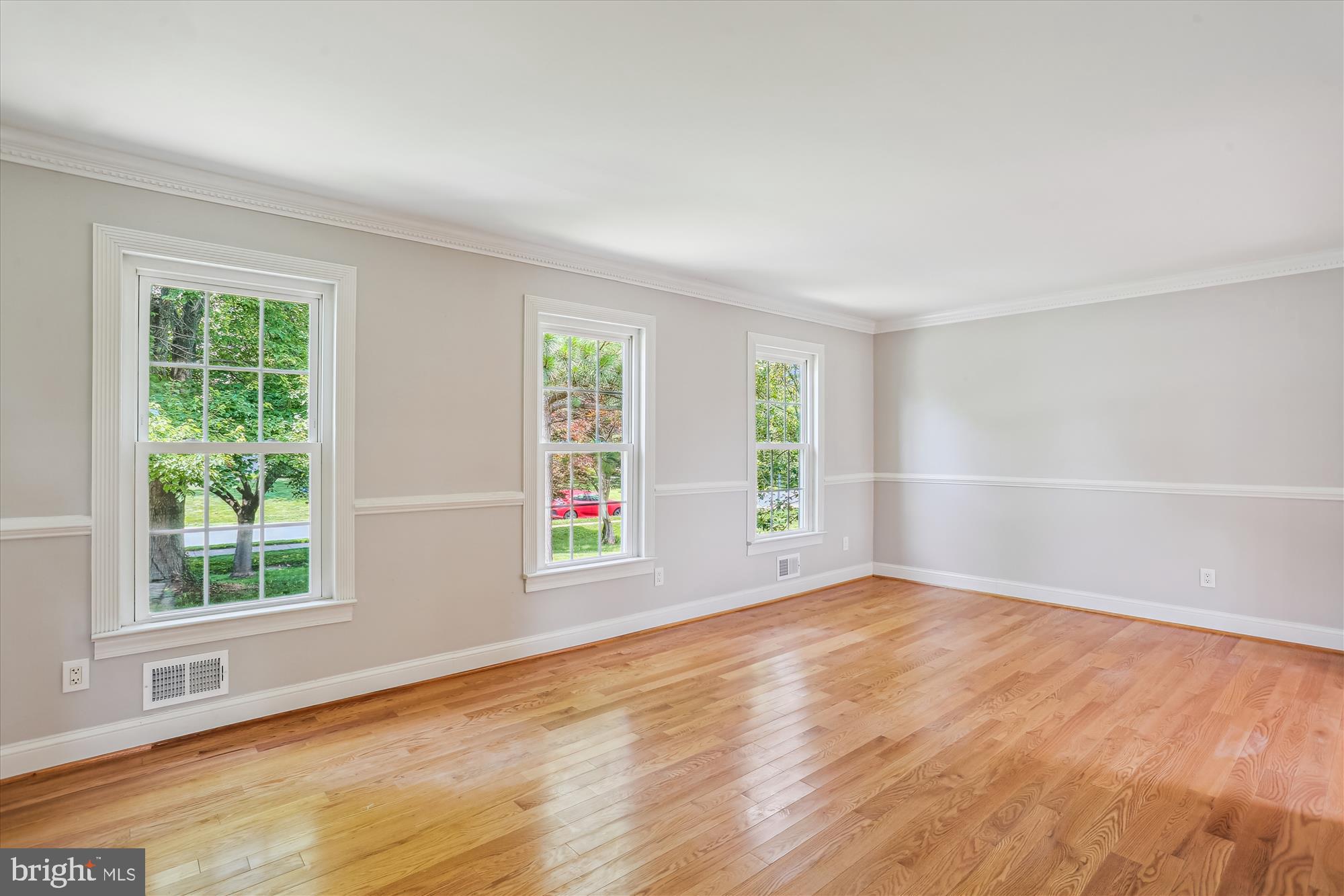 19916 Westerly Avenue Poolesville, MD 20837 - Photo 7 of 34 an empty room with wooden floor and windows