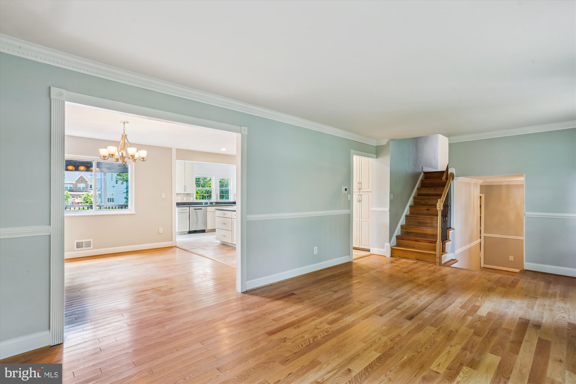 19916 Westerly Avenue Poolesville, MD 20837 - Photo 9 of 34 a view of an empty room with wooden floor and a window