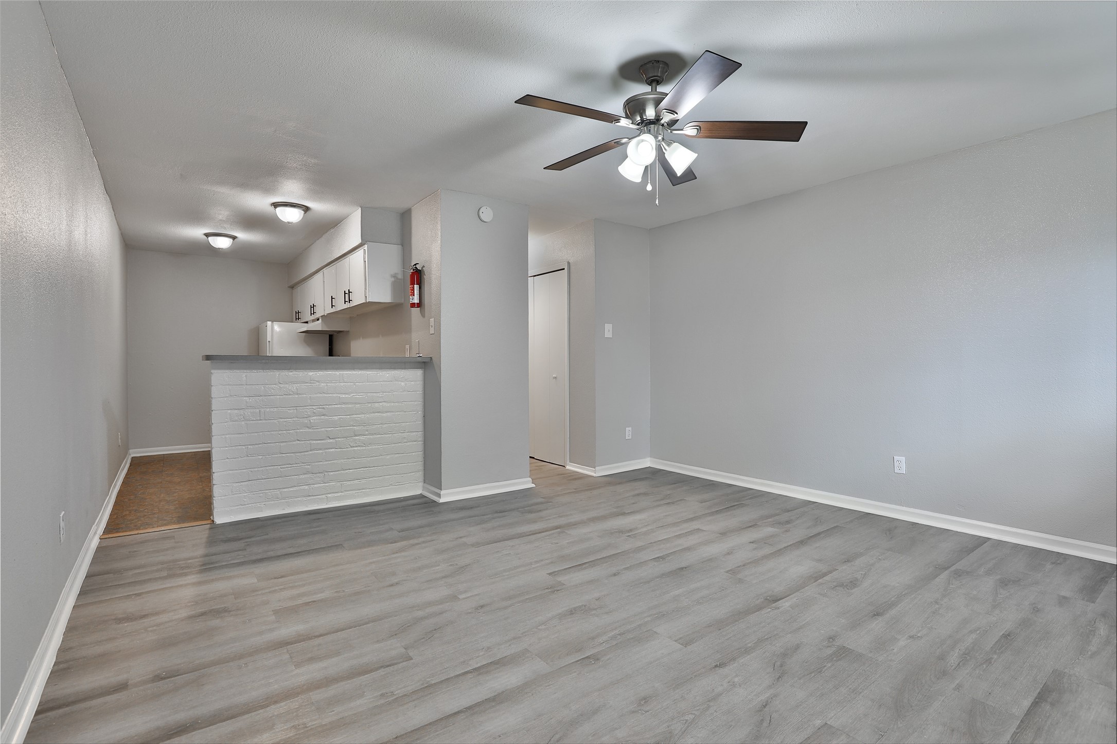 1840 Richmond Avenue, Unit 15 Houston, TX 77098 - Photo 9 of 14 a view of a kitchen with a dishwasher cabinets and wooden floor