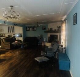 114 North Ave O Post, TX 79356 - Photo 12 of 43 a living room with furniture and a fireplace