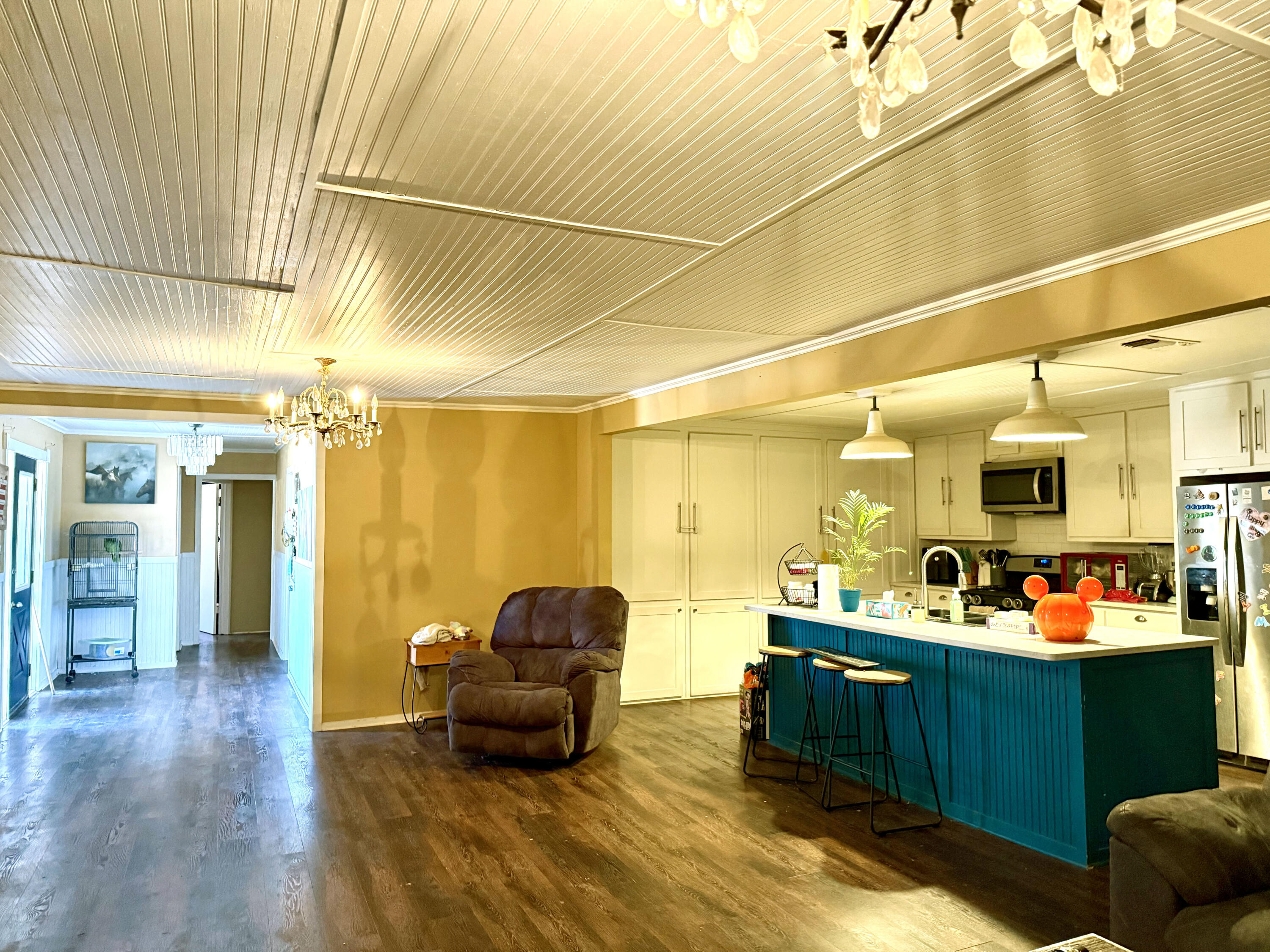 114 North Ave O Post, TX 79356 - Photo 13 of 39 a living room with furniture and a chandelier
