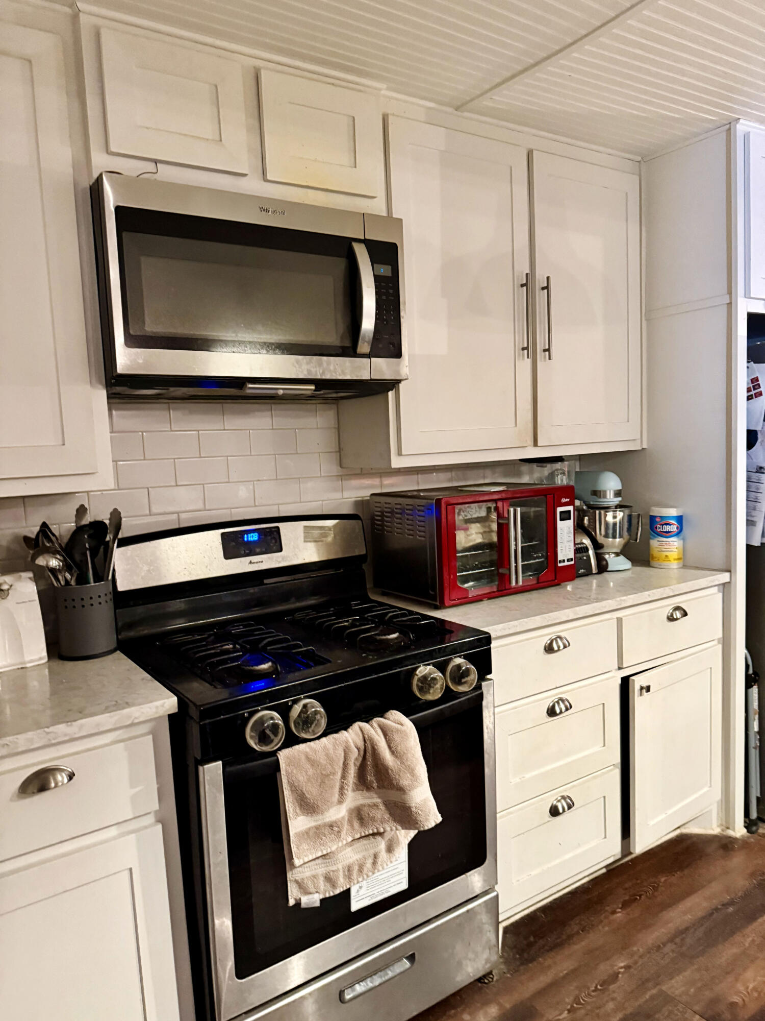 114 North Ave O Post, TX 79356 - Photo 15 of 39 a kitchen with a stove and a microwave