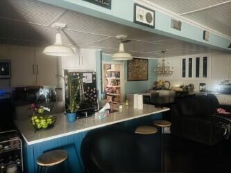 114 North Ave O Post, TX 79356 - Photo 17 of 43 a kitchen with a table and chairs in it