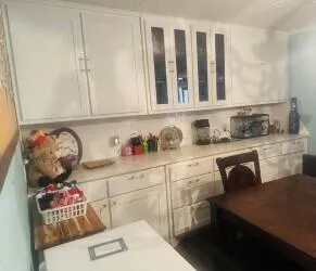 a view of backyard with a small deck