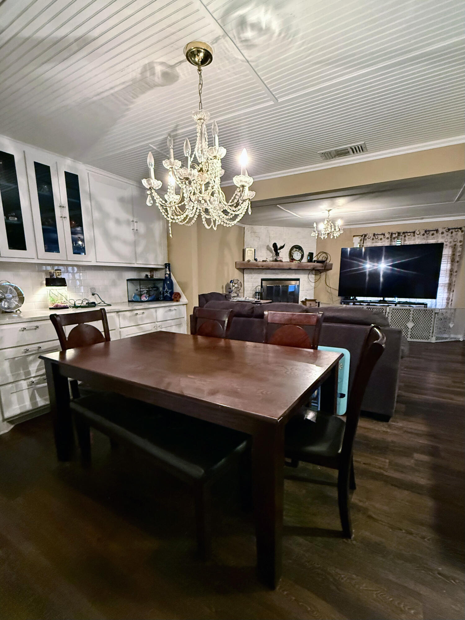 114 North Ave O Post, TX 79356 - Photo 20 of 39 a view of a dining room with furniture a chandelier and wooden floor