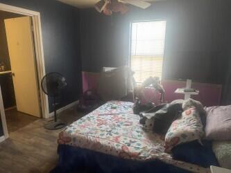 114 North Ave O Post, TX 79356 - Photo 27 of 43 a bedroom with a bed and a window