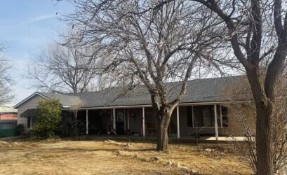114 North Ave O Post, TX 79356 - Photo 37 of 43 a front view of a house with a yard and large tree