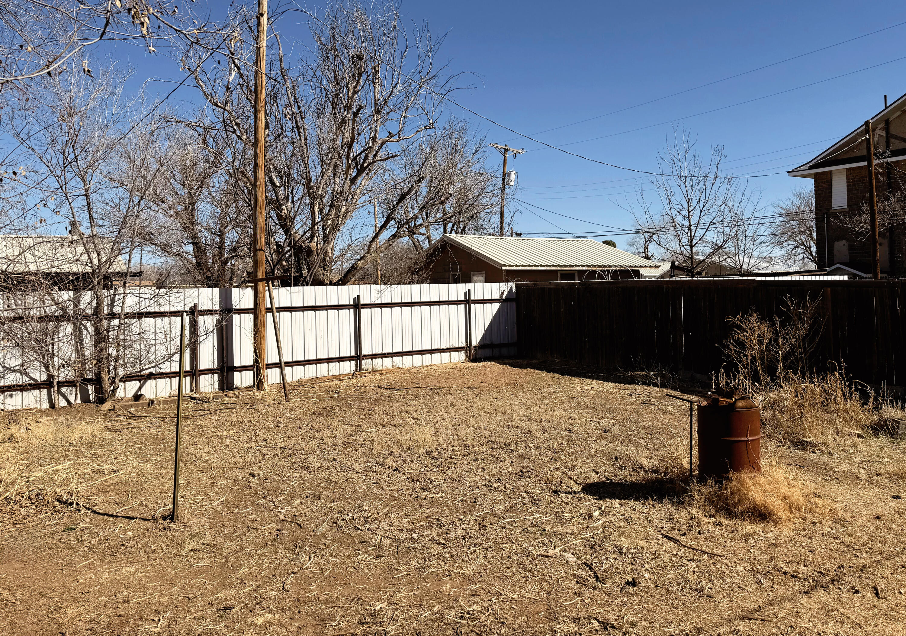 114 North Ave O Post, TX 79356 - Photo 39 of 39 a street view with wooden fence