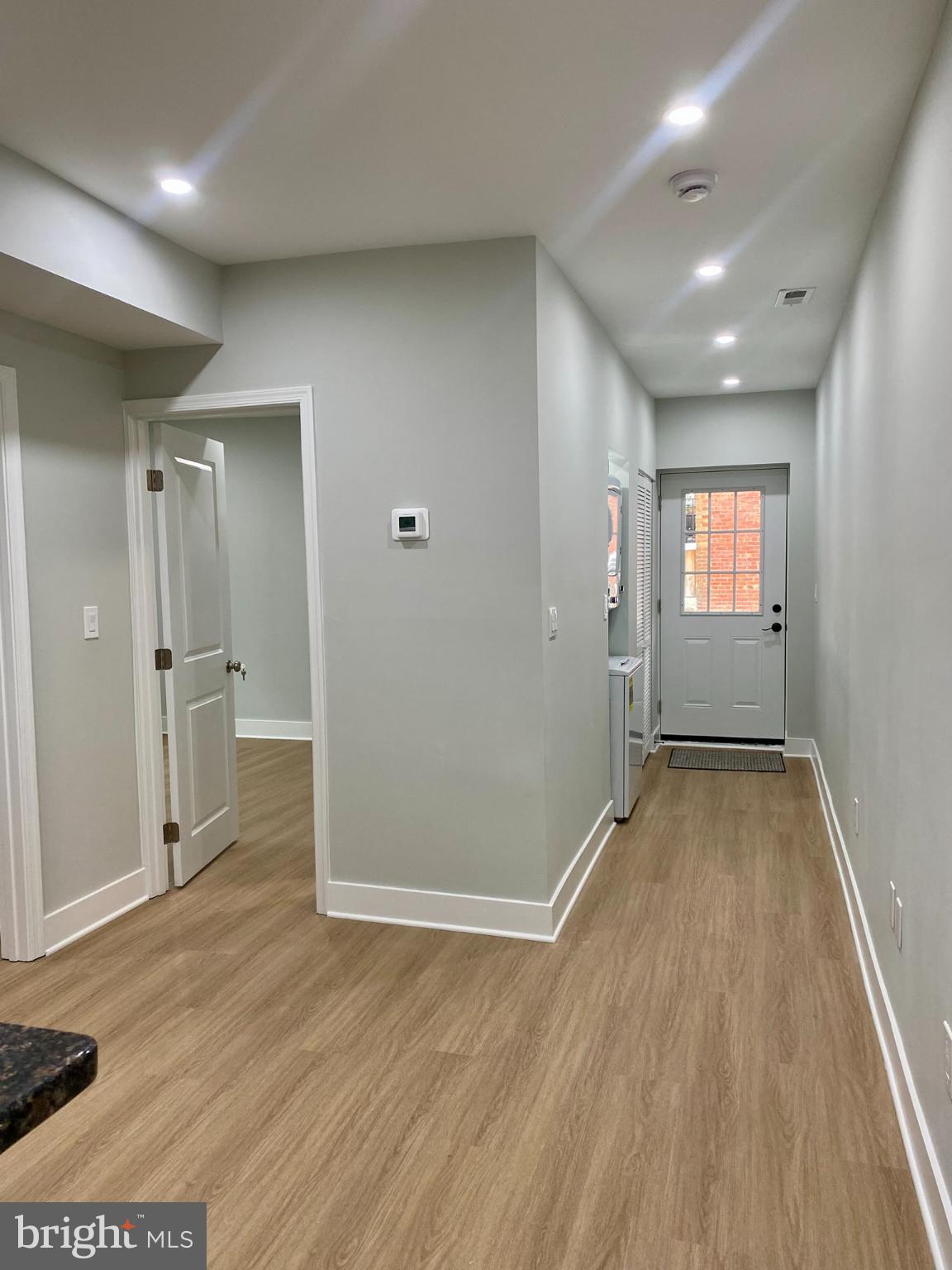 3701 9th Street Northwest, Unit 1 Washington, DC 20010 - Photo 11 of 23 wooden floor in an empty room with a window