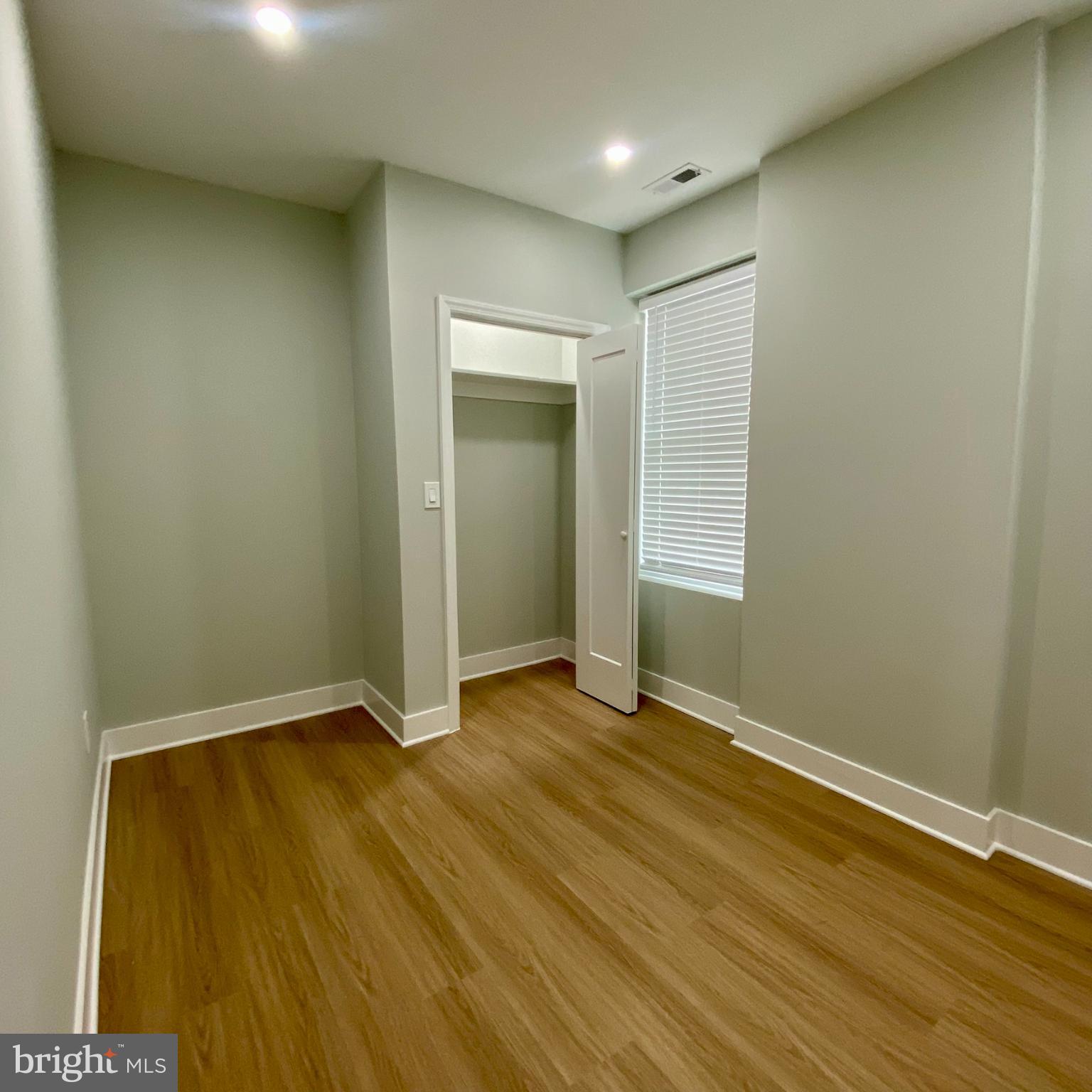 3701 9th Street Northwest, Unit 1 Washington, DC 20010 - Photo 13 of 23 an empty room with wooden floor and closet