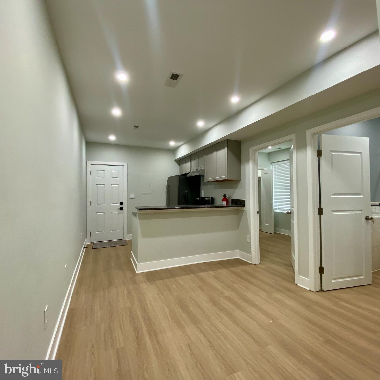 3701 9th Street Northwest, Unit 1 Washington, DC 20010 - Photo 3 of 23 a view of a big room with wooden floor and windows
