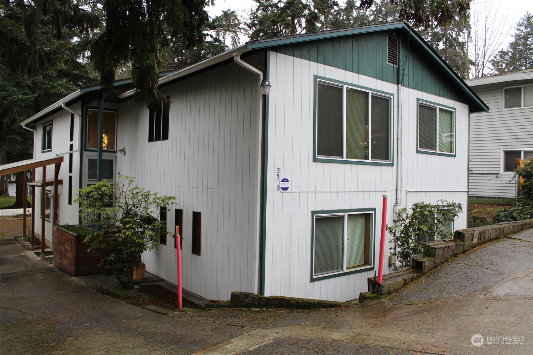 2519 Northeast 145th Street Seattle, WA 98125 - Photo 1 of 34 a view of a house with a yard