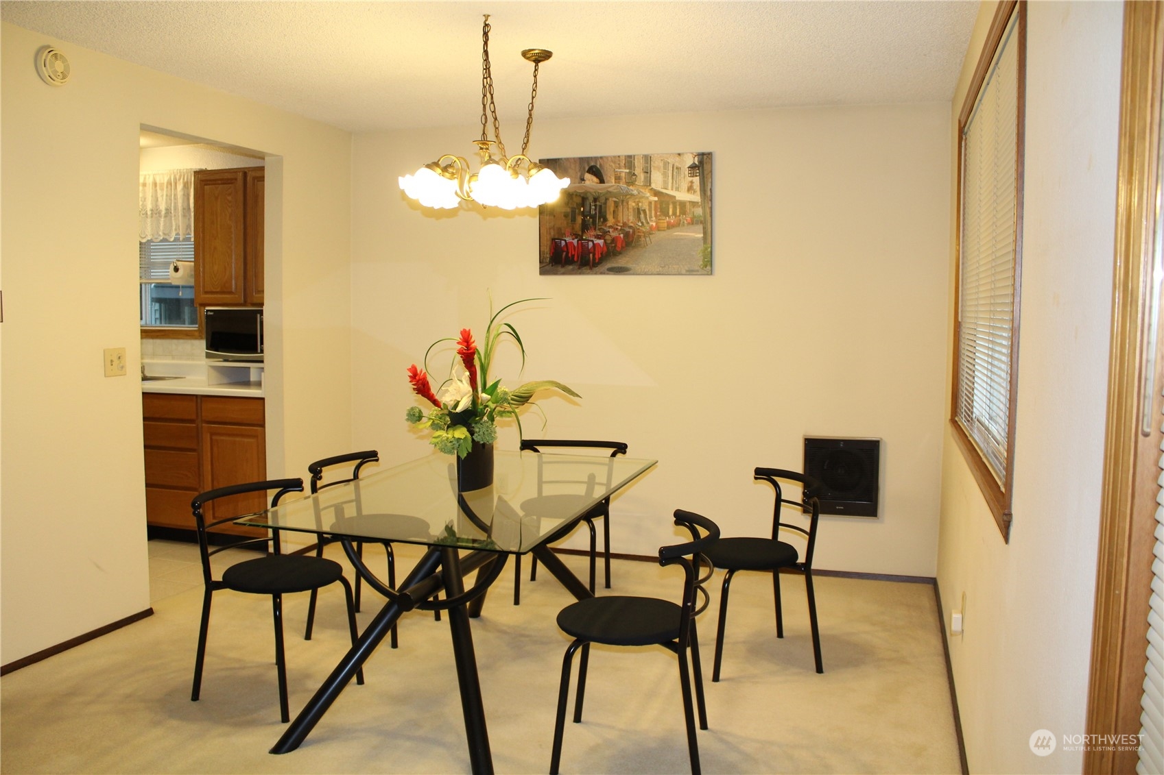 2519 Northeast 145th Street Seattle, WA 98125 - Photo 11 of 34 a view of a dining room with furniture and chandelier