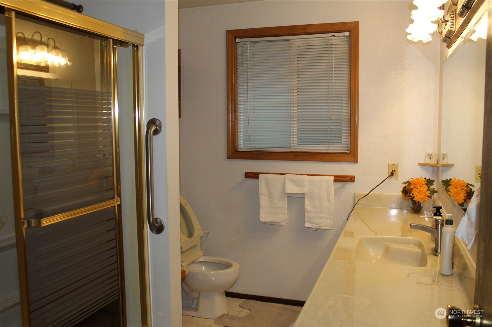 2519 Northeast 145th Street Seattle, WA 98125 - Photo 17 of 34 a bathroom with a sink and a mirror