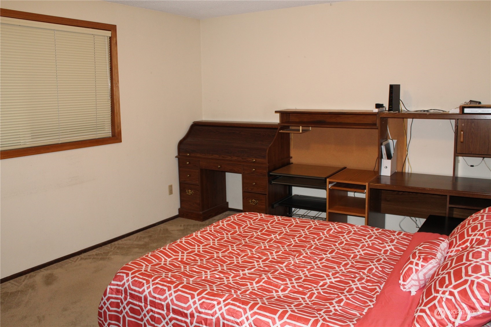 2519 Northeast 145th Street Seattle, WA 98125 - Photo 18 of 34 a bedroom with a bed and a dresser