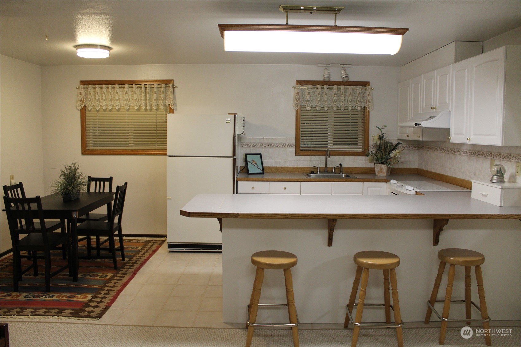 2519 Northeast 145th Street Seattle, WA 98125 - Photo 25 of 34 a kitchen with a table and chairs in it