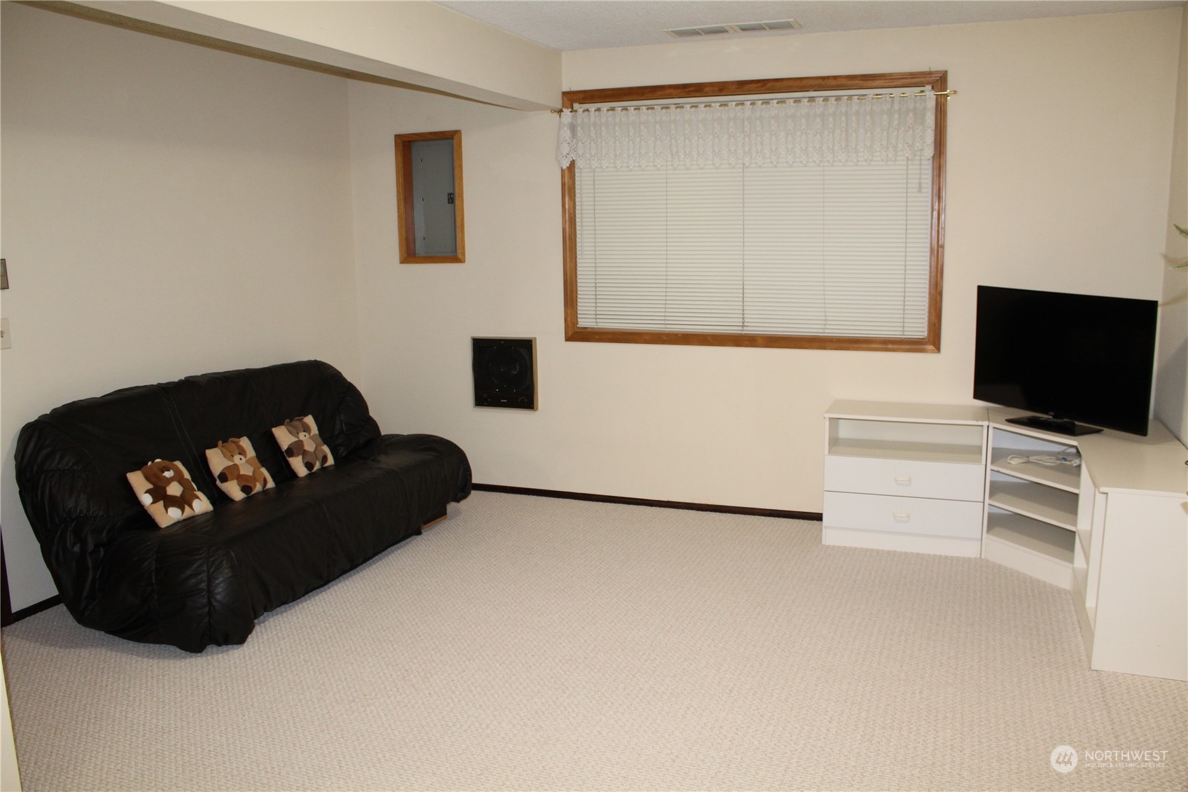 2519 Northeast 145th Street Seattle, WA 98125 - Photo 26 of 34 a living room with furniture and a flat screen tv