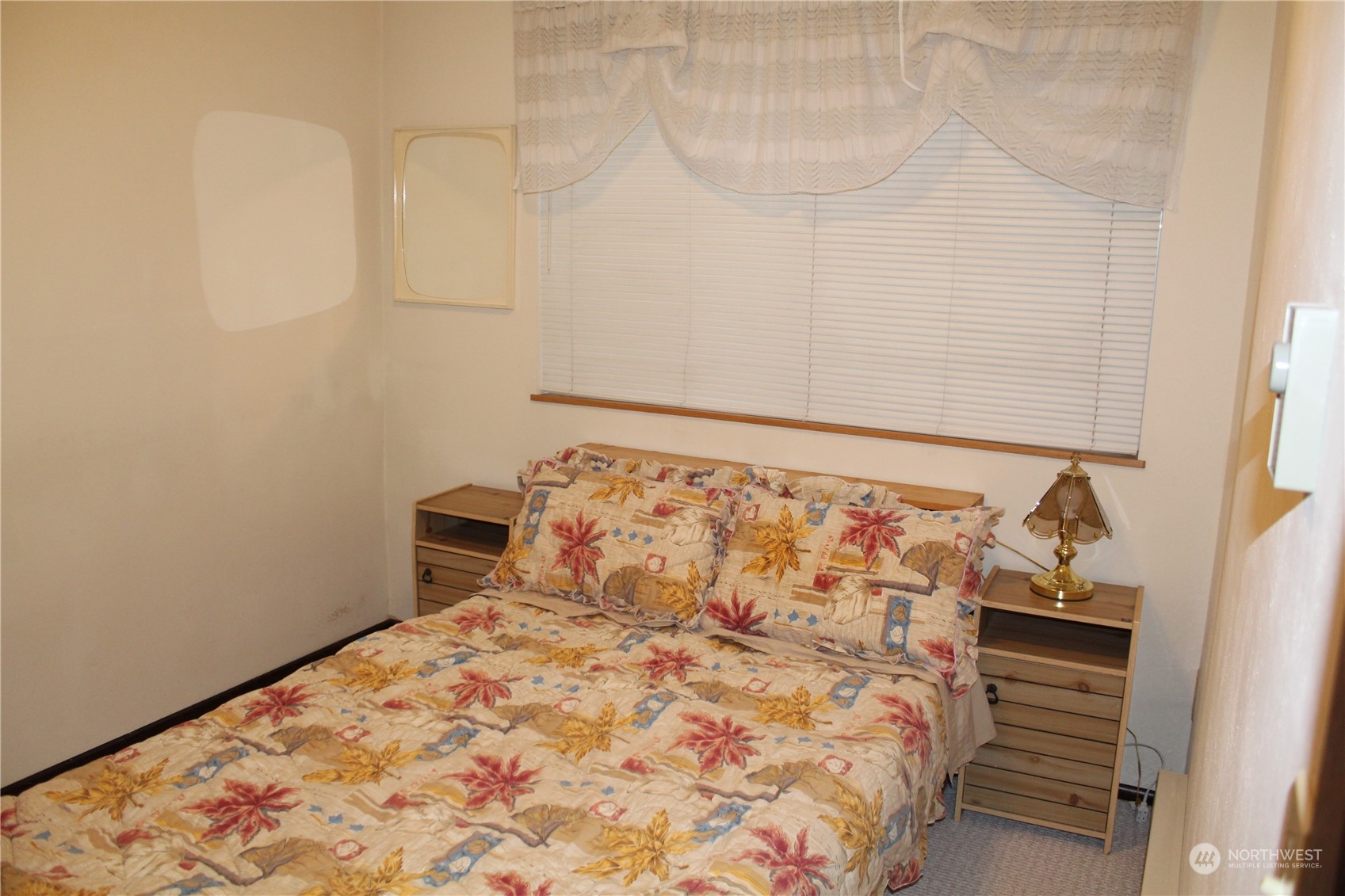 2519 Northeast 145th Street Seattle, WA 98125 - Photo 27 of 34 a bedroom with a bed