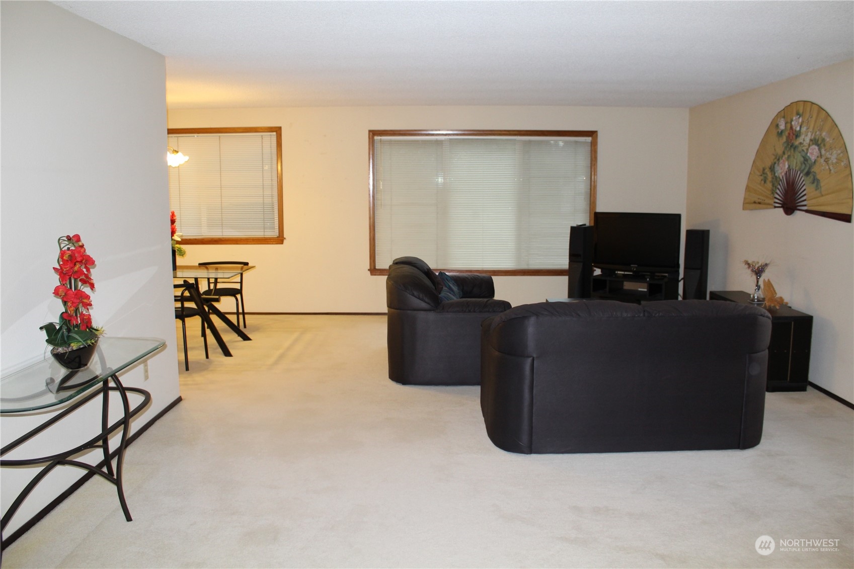 2519 Northeast 145th Street Seattle, WA 98125 - Photo 6 of 34 a living room with furniture and a flat screen tv