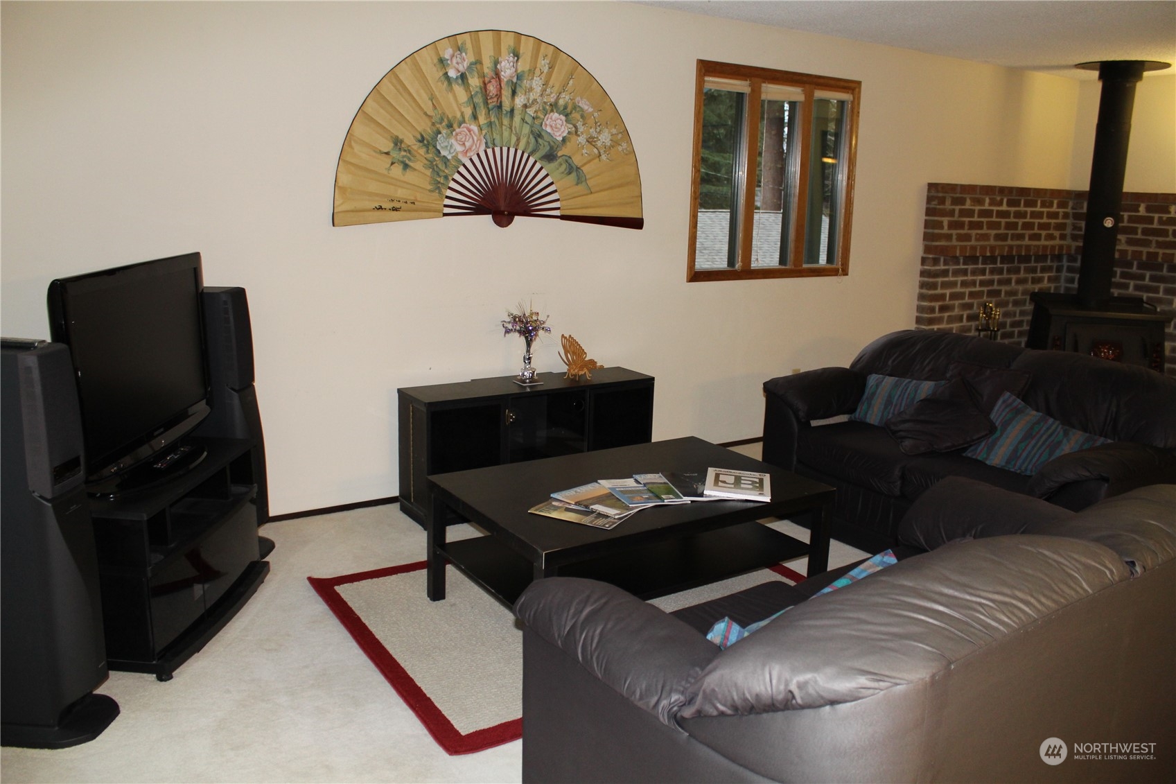 2519 Northeast 145th Street Seattle, WA 98125 - Photo 10 of 34 a living room with furniture and a flat screen tv