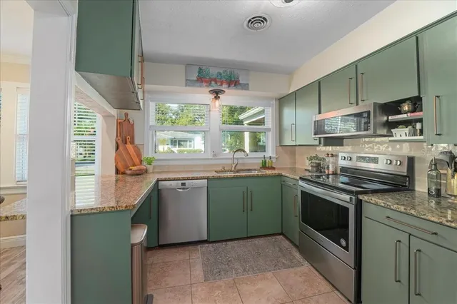 a kitchen with a sink and wooden cabinets