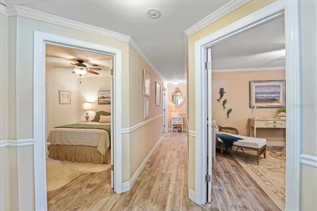 a bedroom with furniture and a wooden floor