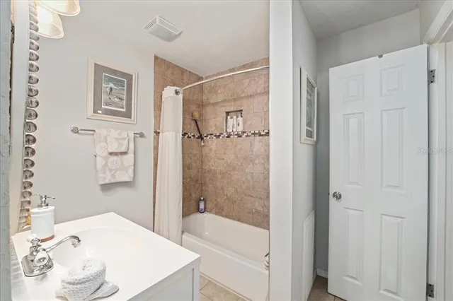 a bathroom with a sink vanity mirror and toilet