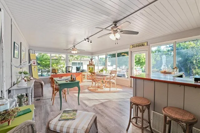 a view of a dining room with furniture window and outside view