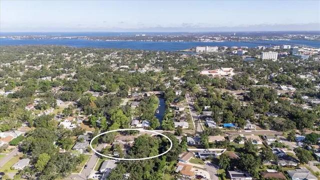 an aerial view of residential house and trees